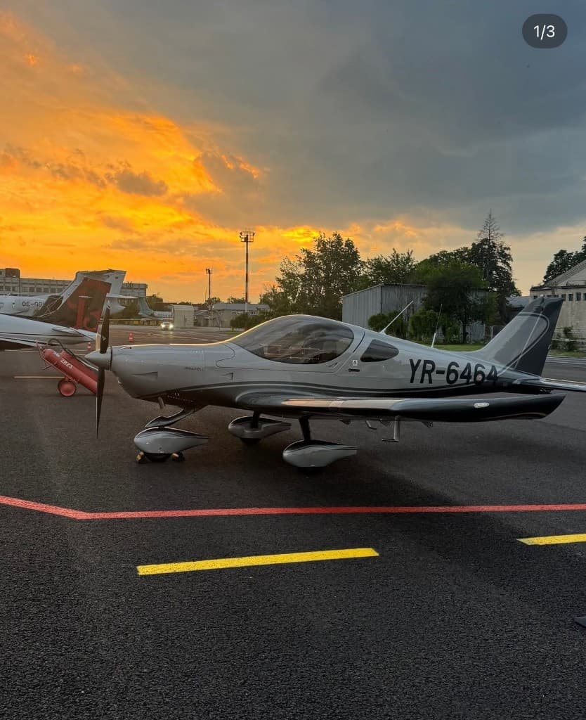 Bristell light sport aircraft parked on the ramp at sunset